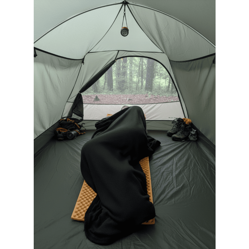 A Jacks R Better quilt used over a sleeping pad inside a tent