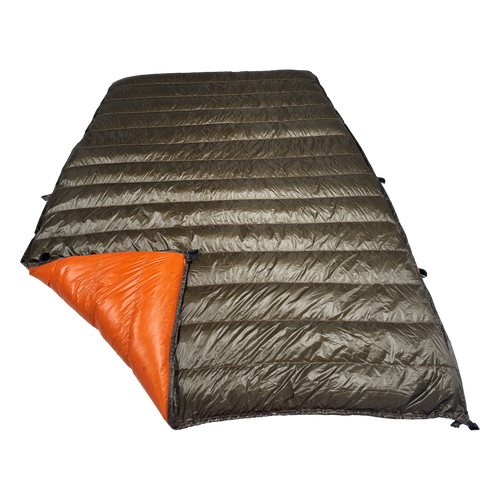 Big Meadows Ultralight 20° quilt with the foot corner turned back, showing the burnt orange interior against the dark olive shell