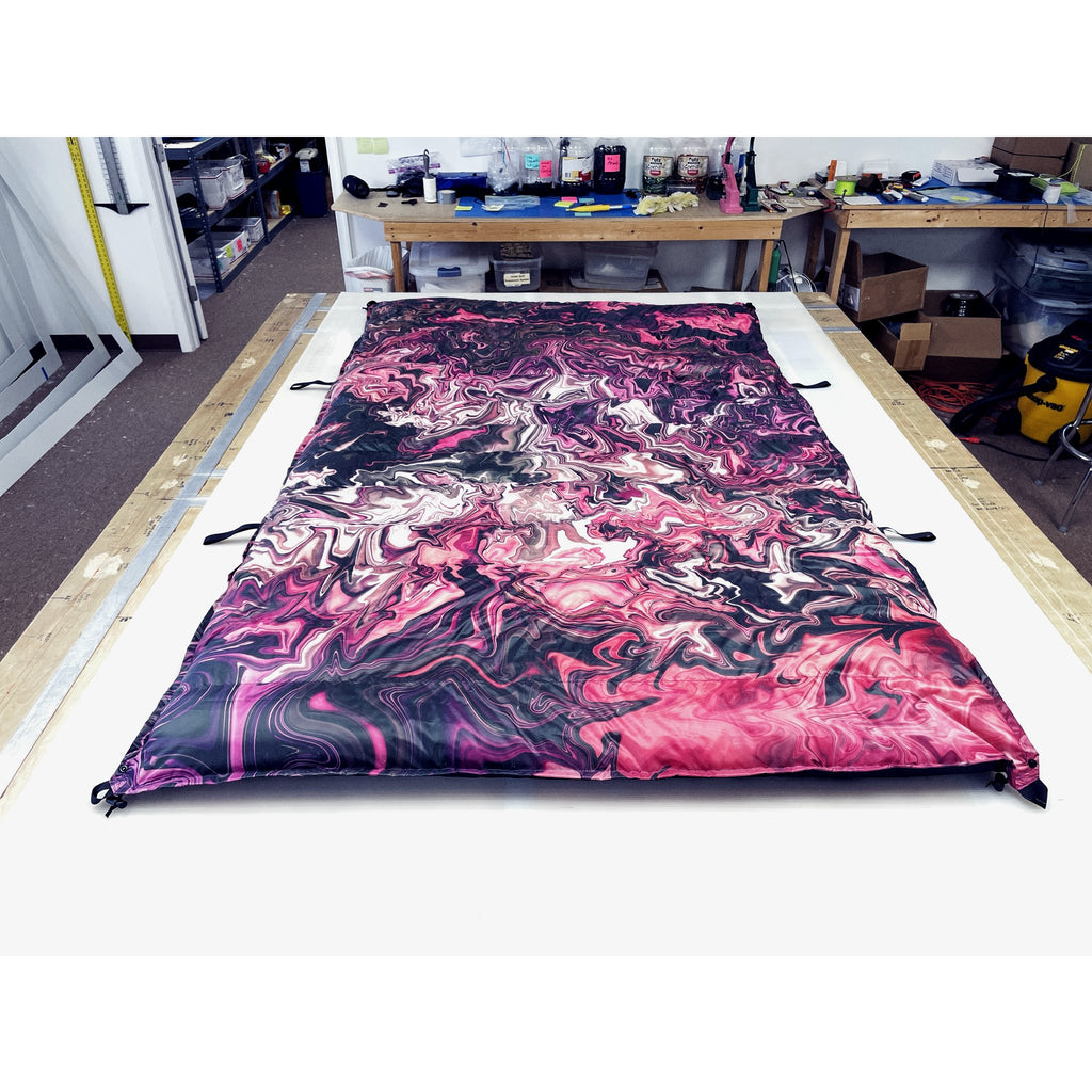 Custom ultralight backpacking quilt in the Pink Liquify print, a pink and magenta swirl