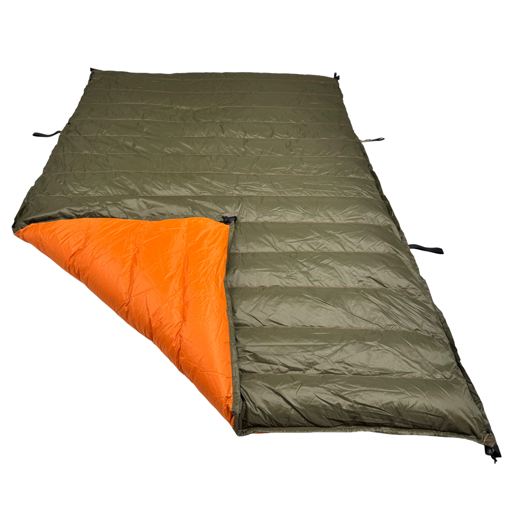 Jacks R Better Hudson River 20 degree camping quilt laid flat showing olive green exterior and orange interior lining with attachment loops