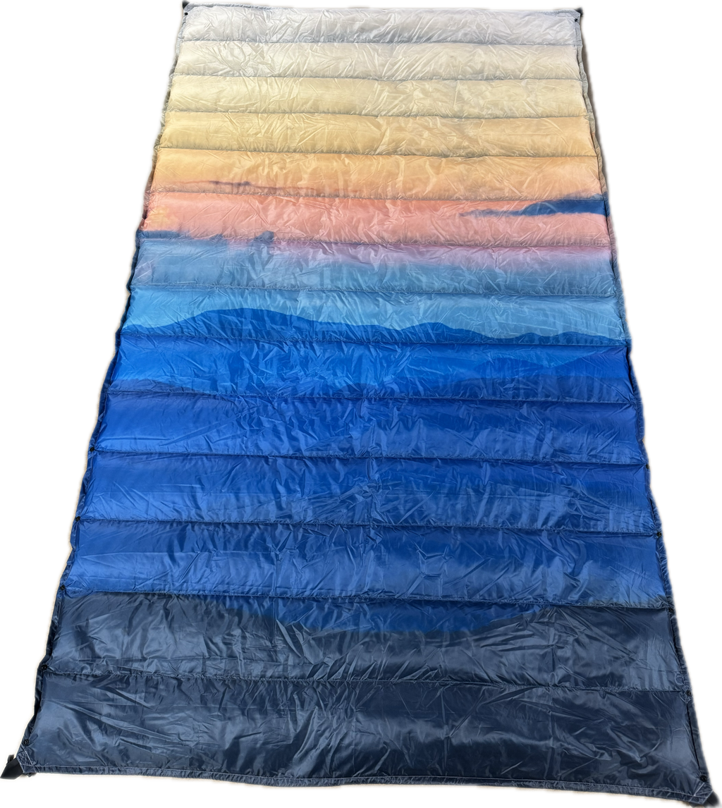 Jacks R Better Wayah Bald Sunset 40°F limited-edition ultralight quilt in the orange-to-blue sunset print