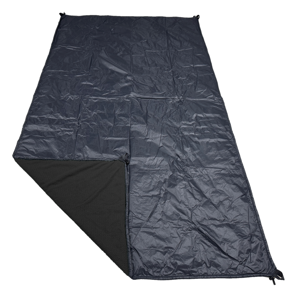 Jacks R Better Wind Gap Alpha wind liner in Black Alpha Direct 90 with the black Ion 1.1 windproof shell, corner folded back to show the Alpha Direct face