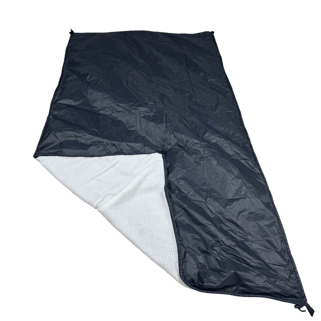 Jacks R Better Wind Gap Alpha White Alpha 120 with the corner folded back showing the black Ion 1.1 windproof shell