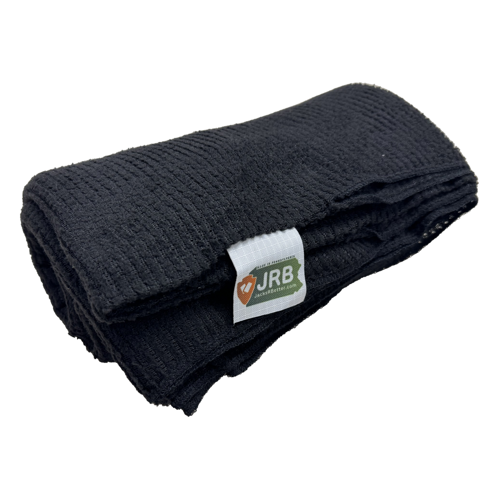 Polartec Alpha Direct Trail 90 quilt liner in black, folded to show the open grid-knit face and the JRB Made in Pennsylvania label