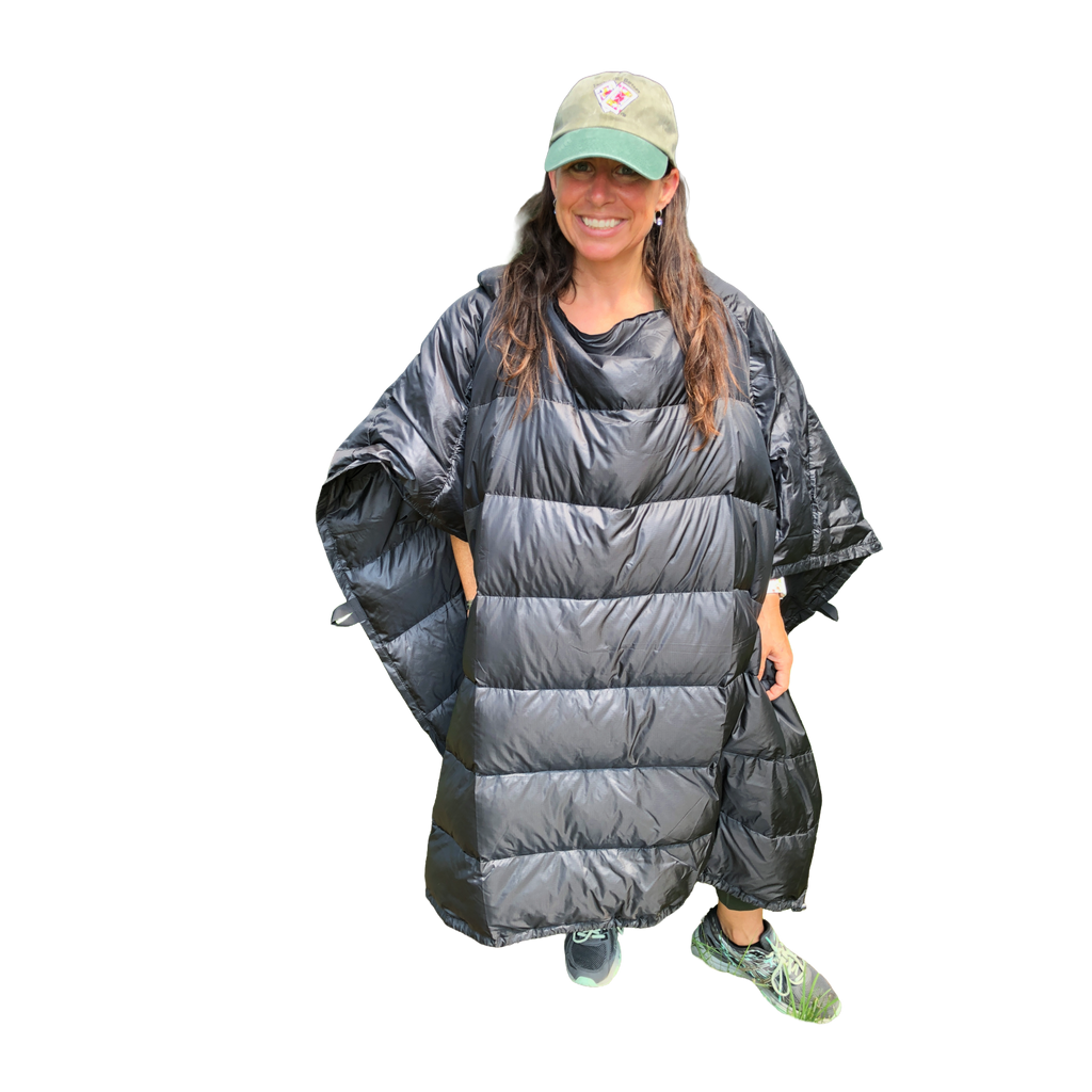 Woman wearing the Jacks R Better Sierra Stealth 40° wide wearable down quilt as a wrap, front view